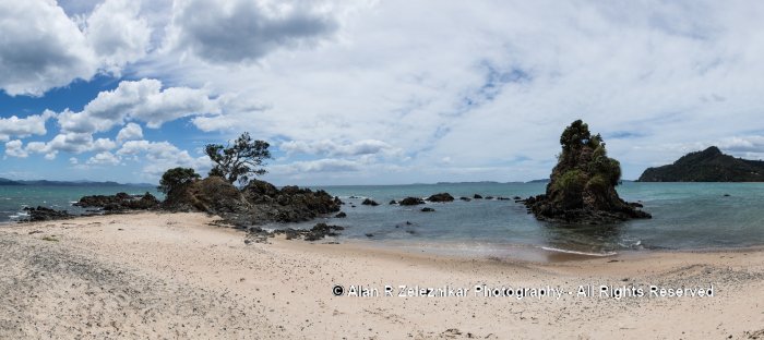 A panorama image of the beach at Kauotunu, New Zealand